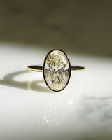 Bezel Set 3.05 Ct Oval Cut Moissanite Engagement Ring